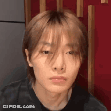 Close Up Of Person's Face With Red Background GIF