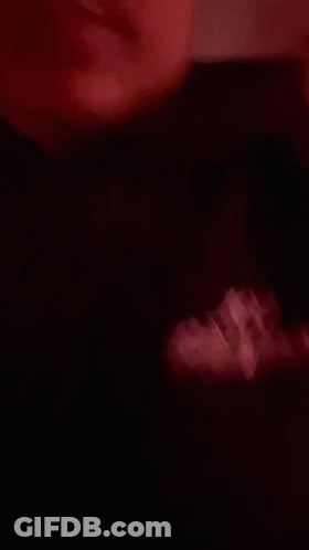 Close Up Of Person's Face With Red Light GIF