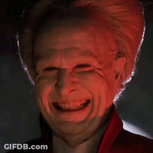 Close Up Of Person's Face With Red Light GIF