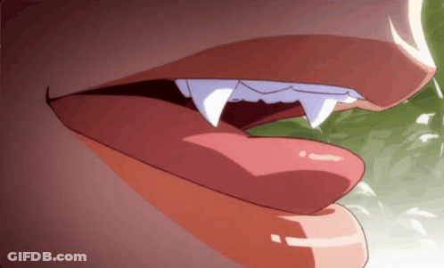 Close Up Of Person's Mouth With Long Teeth GIF