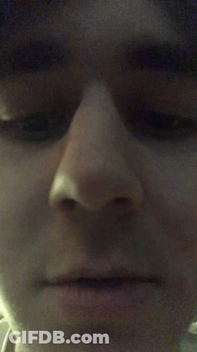 Close Up Of Person's Serious Face GIF