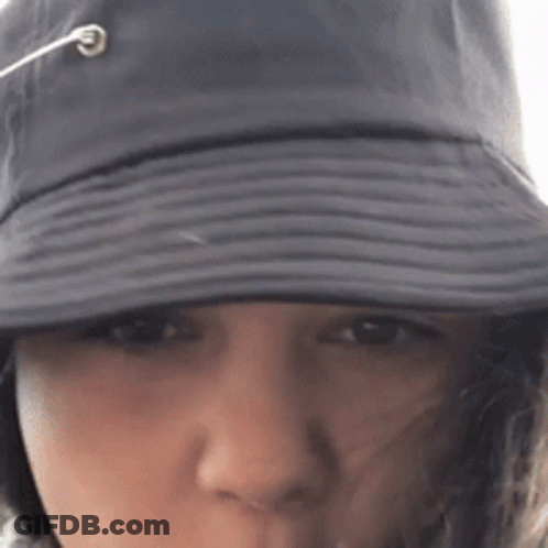 Close Up Of Person Wearing Hat With Rope Coming Out GIF