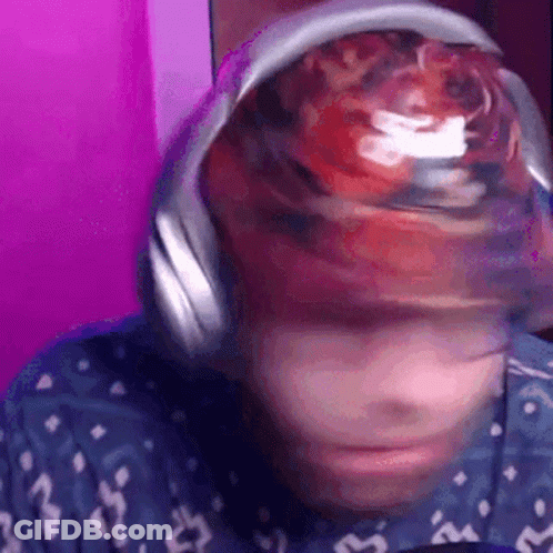 Close Up Of Person Wearing Headphones And Hat With Ball GIF