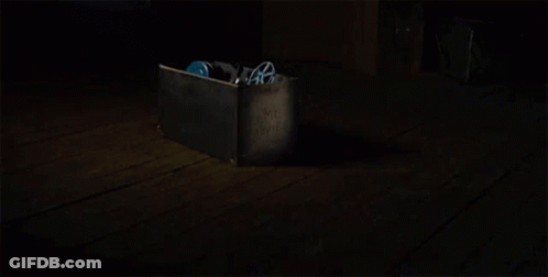 Close Up Of Person Wearing Mask In The Dark GIF
