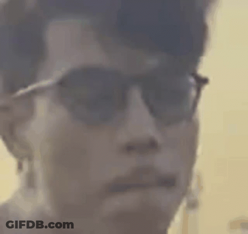 Close-Up Of Person Wearing Sunglasses And Ear Buds GIF