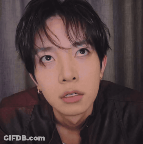 Close Up Of Person With Black Hair And Brown Jacket GIF