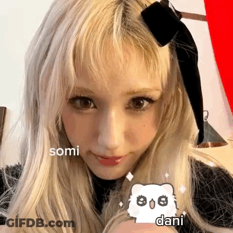 Close Up Of Person With Blonde Hair And Black Bow GIF