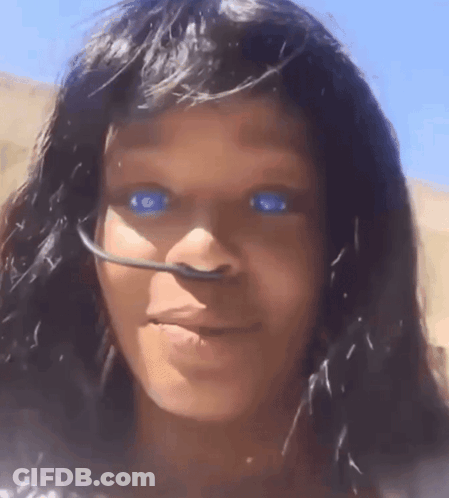 Close Up Of Person With Blue Eyes And Black Hair GIF