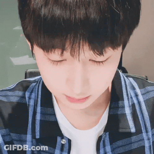 Close Up Of Person With Eyes Closed Plaid Shirt GIF