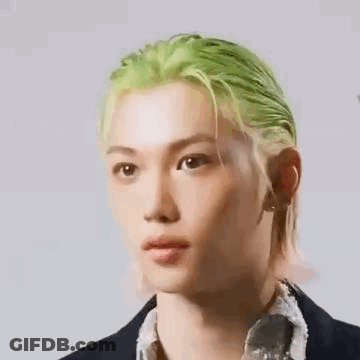 Close Up Of Person With Green Hair Wearing Suit GIF