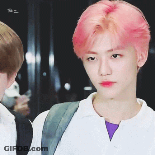 Close-Up Of Person With Purple Shirt And Pink Hair GIF