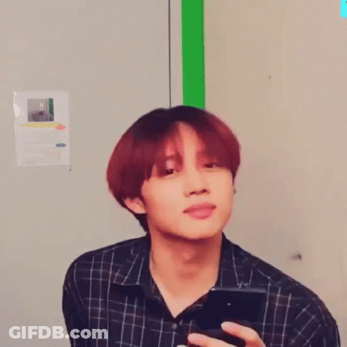 Close Up Of Person With Red Hair And Green Background GIF