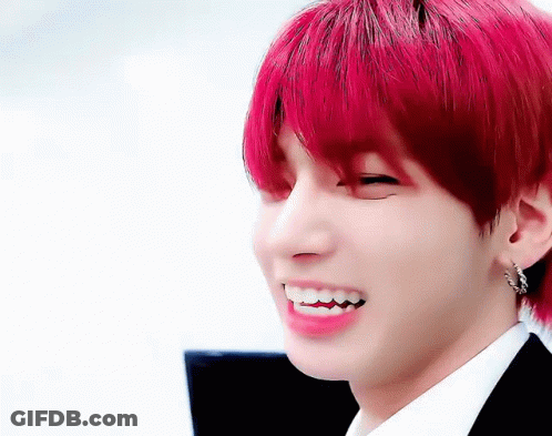 Close-Up Of Person With Red Hair And Teeth GIF