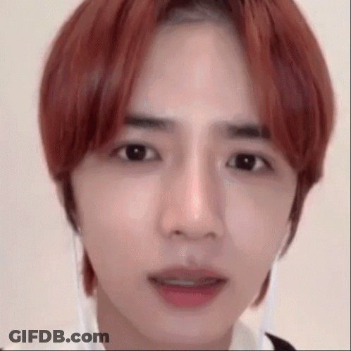 Close Up Of Person With Red Hair And White Shirt GIF