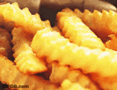 Close Up Of Pile Of French Fries GIF