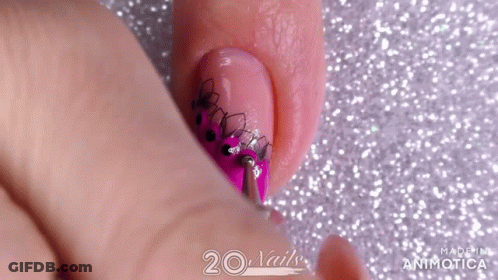 Close-Up Of Pink Nail Polish Design GIF
