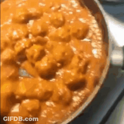 Close Up Of Pizza In Pan On Stove GIF