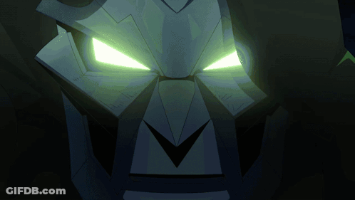 Close Up Of Robot Face With Glowing Green Eyes GIF