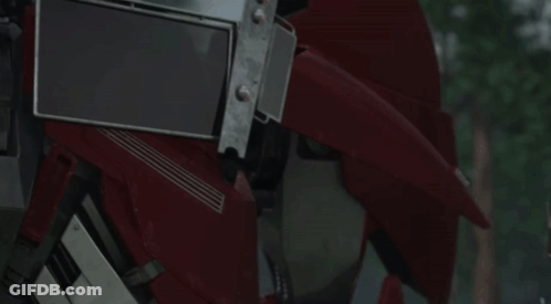 Close Up Of Robot Head With Blue Eyes GIF
