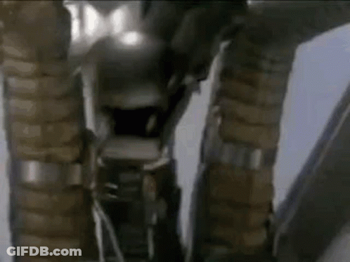 Close Up Of Robot Legs And Arms In Room GIF