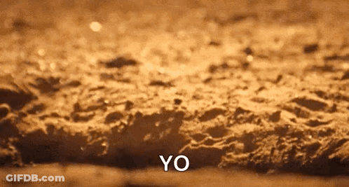 Close Up Of Sandy Surface Saying Yo GIF