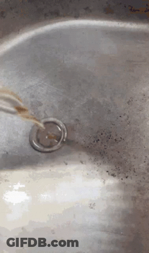 Close Up Of Sink With Drain And Faucet GIF