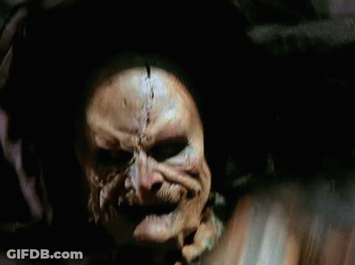 Close Up Of Skeleton Face In Dark Room GIF
