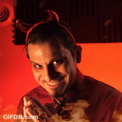 Close Up Of Smirking Man's Face GIF