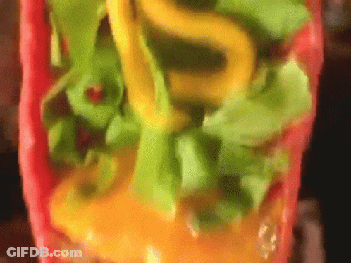 Close Up Of Taco With Lettuce And Cheese GIF