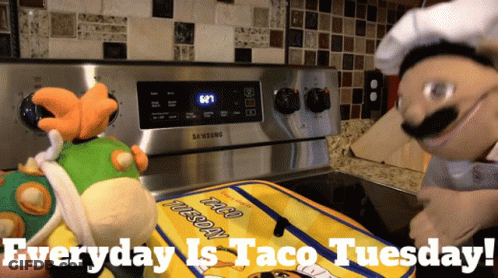 Close Up Of Taco With Lettuce And Cheese GIF