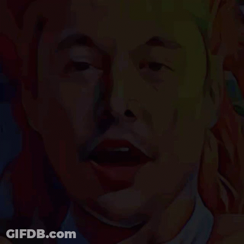 Close Up Of Tesla Logo With Man In Background GIF