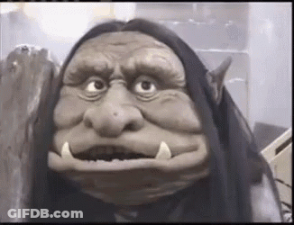Close Up Of Troll Puppet With Long Hair GIF