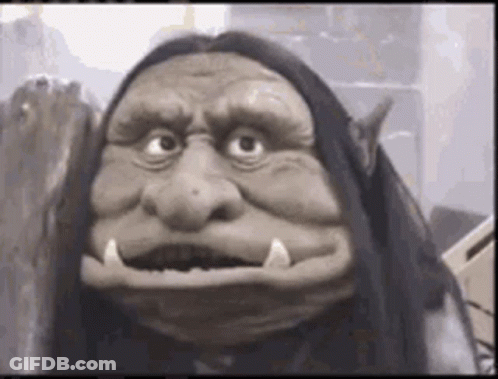 Close Up Of Troll Puppet With Long Hair GIF