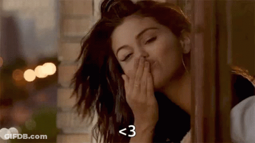 Close Up Of Woman Blowing A Kiss GIF
