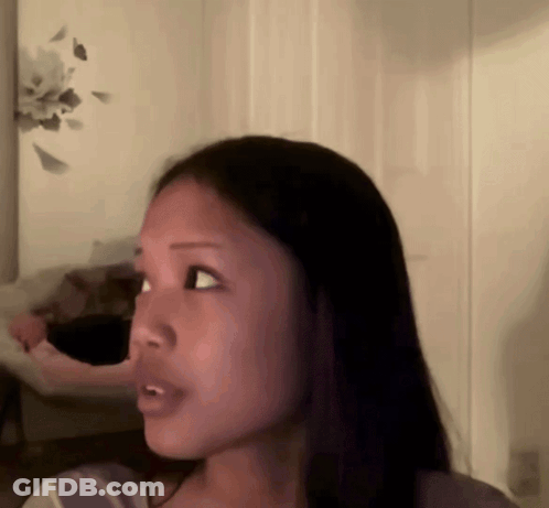Close Up Of Woman Face In Room GIF