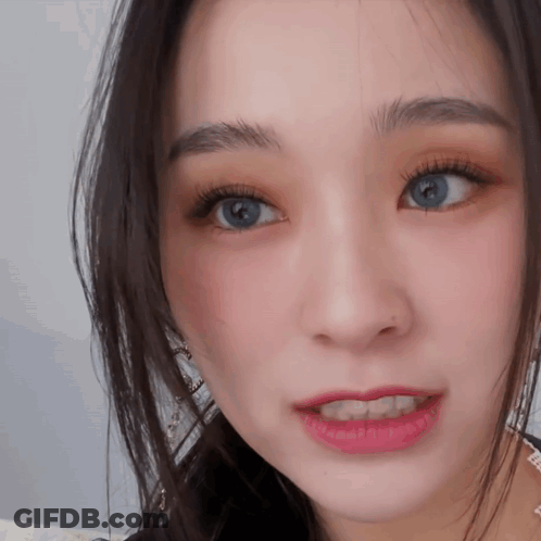 Close Up Of Woman Face With Blue Eyes And Red Lipstick GIF