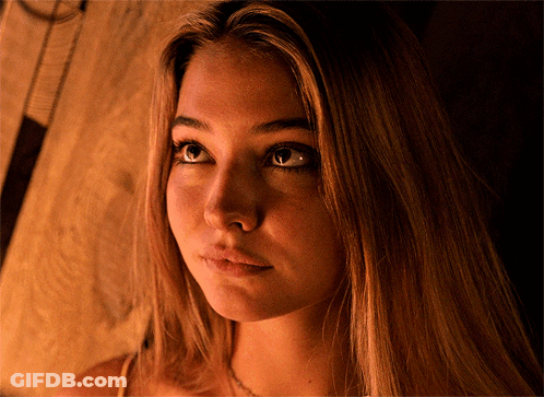 Close Up Of Woman Face With Brown Background GIF