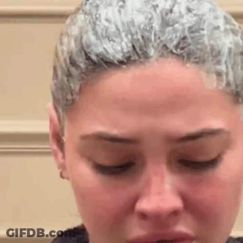Close Up Of Woman Face With Hair Dye GIF
