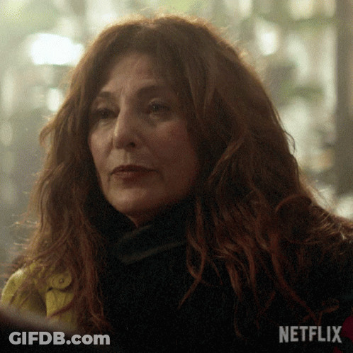 Close Up Of Woman Face With Netflix Logo In Background GIF