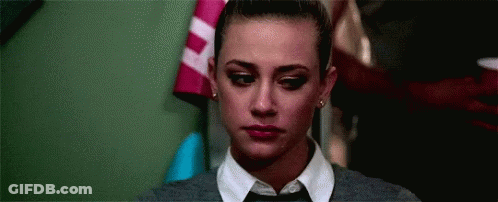 Close Up Of Woman In Tie And Sweater GIF
