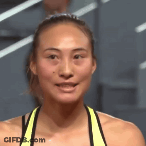 Close Up Of Woman In Yellow Tank Top GIF