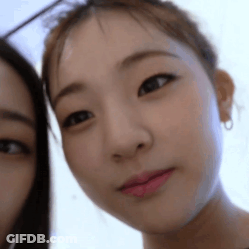 Close Up Of Woman Looking At Camera Another Woman Looking On GIF