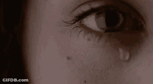 Close Up Of Woman's Crying Eye With Tear GIF