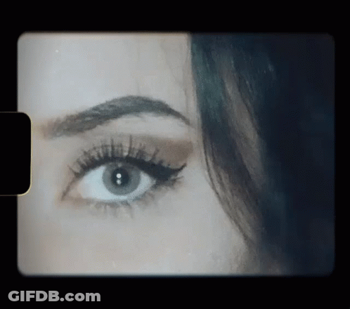 Close Up Of Woman's Eye On Black Background GIF