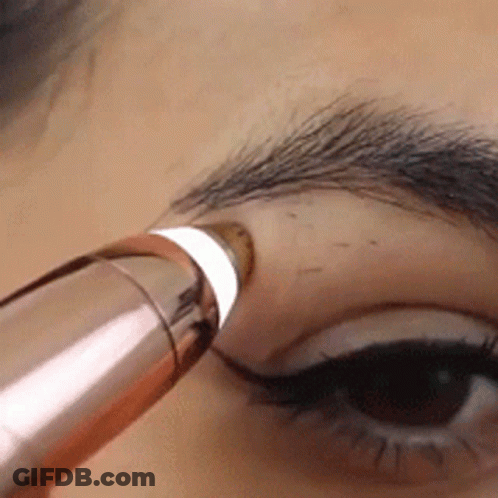 Close Up Of Woman's Eye With Brush GIF