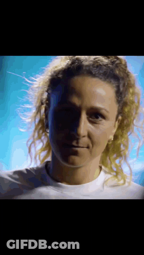 Close Up Of Woman's Face In Dark Room GIF
