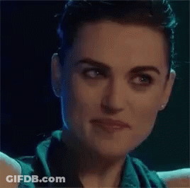 Close Up Of Woman's Face In Dark Room GIF