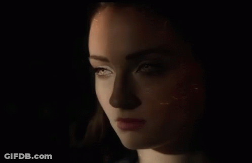 Close Up Of Woman's Face In The Dark GIF