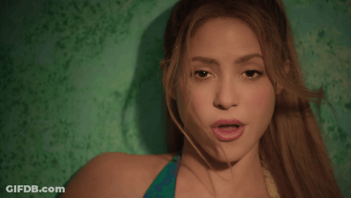 Close Up Of Woman's Face On Green Background GIF