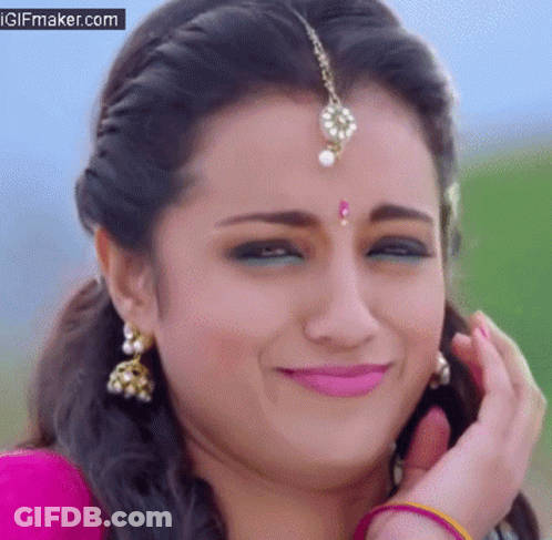 Close Up Of Woman's Face With Bindi And Earrings GIF